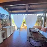 Apartment In Marinella With Garden